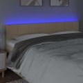 vidaXL Čelo postele s LED krémové 160x5x78/88 cm látka