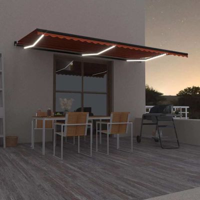 vidaXL Manuálna zaťahovacia markíza s LED diódami 600x300 cm oranžová a hnedá