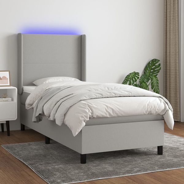 vidaXL Posteľ boxsping s matracom a LED bledosivá 90x190 cm látka