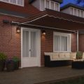 vidaXL Ručná zaťahovacia markíza s LED hnedá 500x300 cm