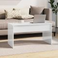 vidaXL Konferenčný stolík lesklý biely 102x50,5x52,5 cm sprac. drevo