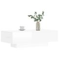 vidaXL Konferenčný stolík lesklý biely 100x49,5x31 cm kompozitné drevo