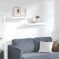vidaXL Plávajúce nástenné police 2 ks, lesklé biele 60x23,5x3,8cm, MDF