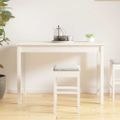vidaXL Jedálenský stolík biely 110x55x75 cm borovicový masív