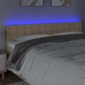 vidaXL Čelo postele s LED krémové 160x5x78/88 cm látka