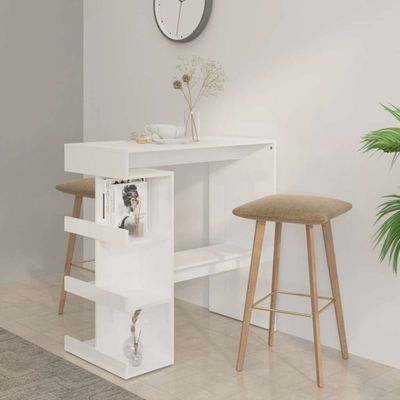 vidaXL Barový stôl s úložným regálom vysoký lesk biely 100x50x101,5 cm