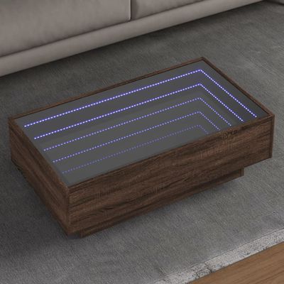 vidaXL Konferenčný stolík s LED hnedý dub 90x50x30 cm kompozitné drevo