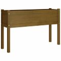 vidaXL Záhradný kvetináč medovo-hnedý 110x31x70 cm borovicový masív
