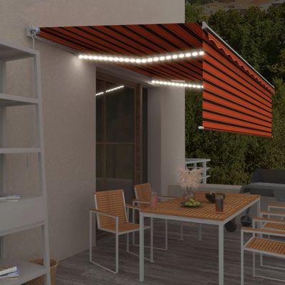 vidaXL Ručne zaťahovacia markíza s tienidlom a LED 5x3m oranžovo-hnedá