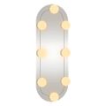 vidaXL Nástenné zrkadlo s LED svetlami 15x40 cm sklo oválne