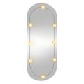 vidaXL Nástenné zrkadlo s LED svetlami 25x60 cm sklo oválne
