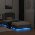 vidaXL Posteľný rám s čelom a LED svetlami betónovo sivý 75x190 cm