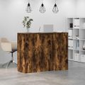 vidaXL Recepčný stôl dymový dub 135x50x103,5 cm kompozitné drevo