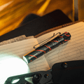 I3T EOS 
(Black Lava) OLIGHT 1 x 1.5V AAA Alkaline 
Battery (Included)