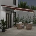 vidaXL Ručne zaťahovacia markíza s LED hnedá 600x350 cm