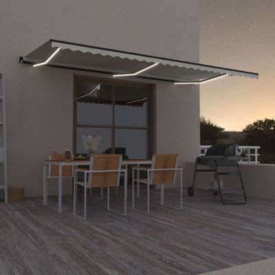 vidaXL Ručne zaťahovacia markíza s LED 600x350 cm krémová