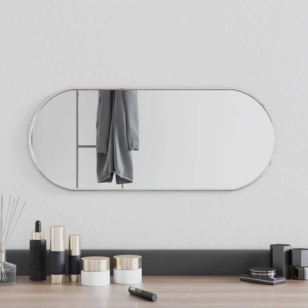 vidaXL Nástenné zrkadlo strieborné 60x25 cm oválne
