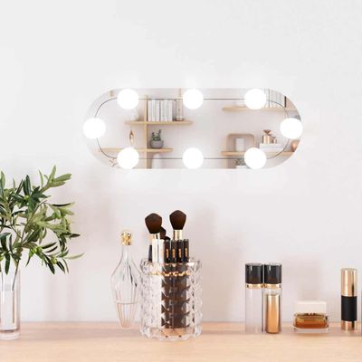 vidaXL Nástenné zrkadlo s LED svetlami 15x40 cm sklo oválne