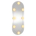 vidaXL Nástenné zrkadlo s LED svetlami 20x50 cm sklenené oválne