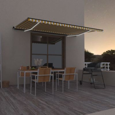 vidaXL Ručne zaťahovacia markíza s LED 500x300 cm žltá a biela