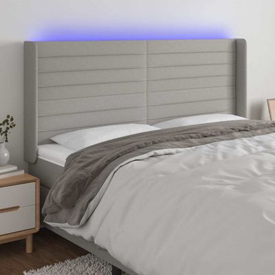 vidaXL Čelo postele s LED bledosivé 183x16x118/128 cm látka